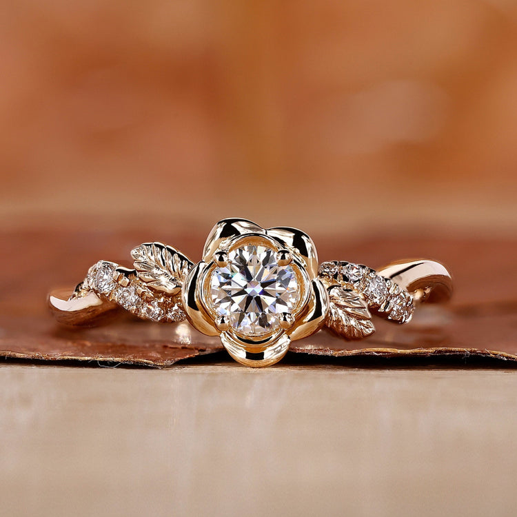 Handmade nature-inspired round diamond engagement ring with floral design and twisted pave band