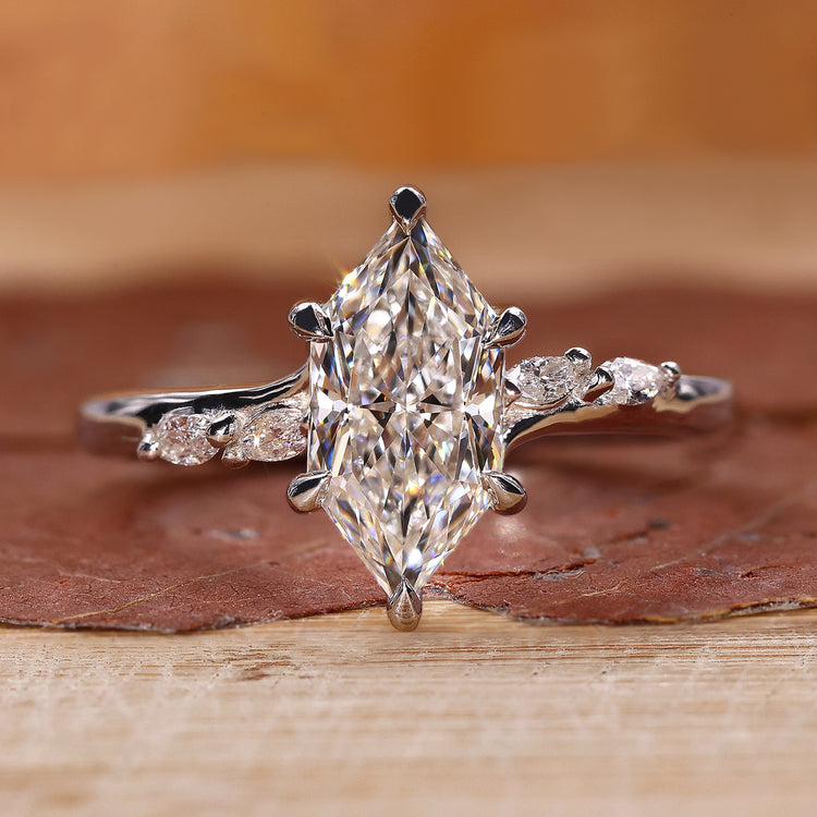 Dutch marquise diamond ring with marquise and round side stone.