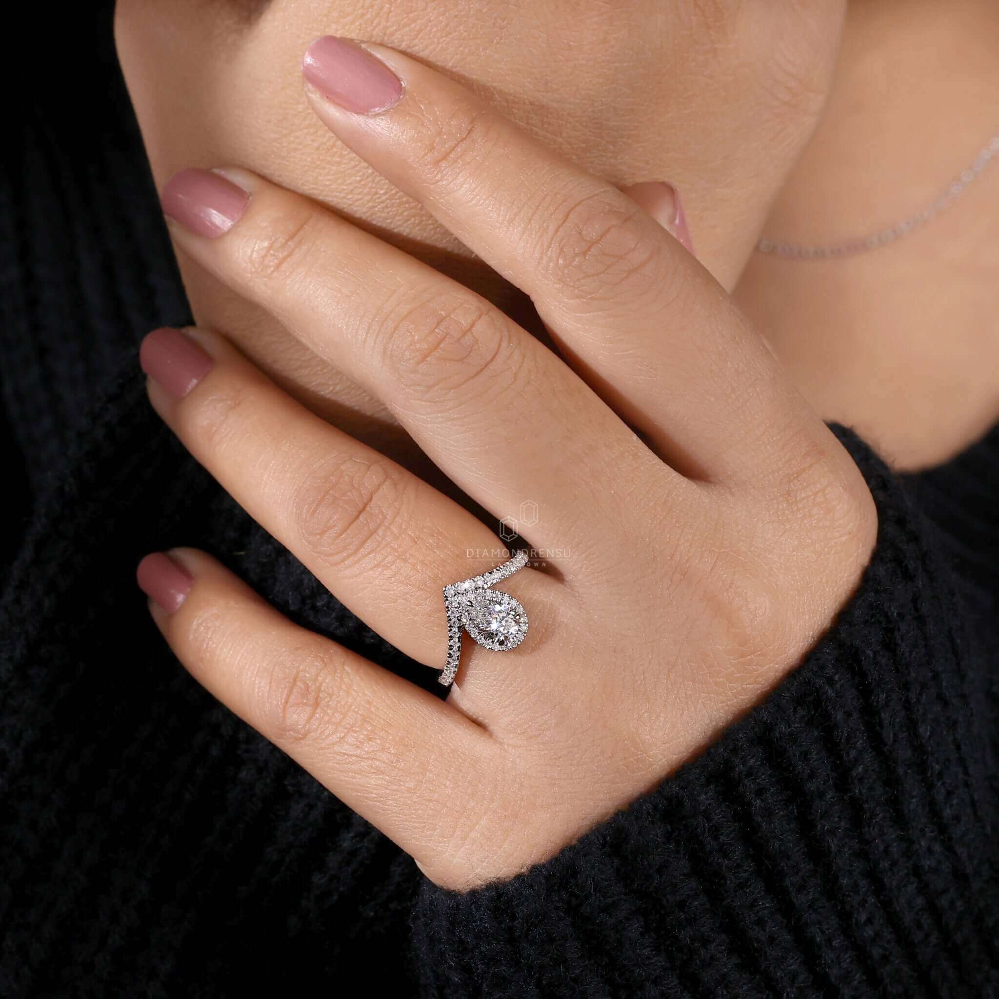 Chevron pear ring with pave diamonds, a stunning unique engagement ring perfect for proposals or special moments.