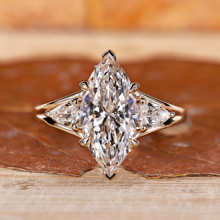 3 stone engagement ring with marquise engagement ring.