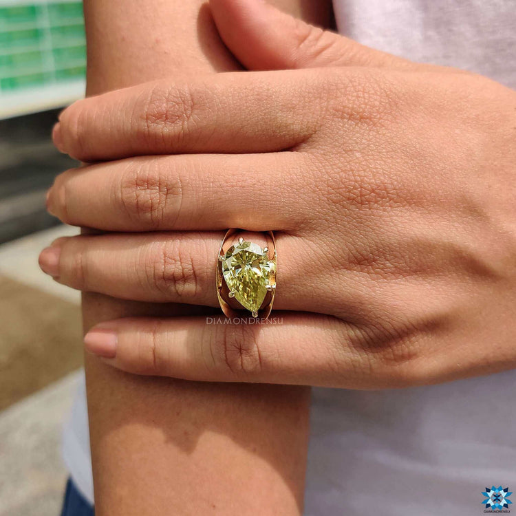Handmade pear shaped canary yellow moissanite ring.
