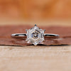 Solitaire engagement ring with a hexagon diamond design.