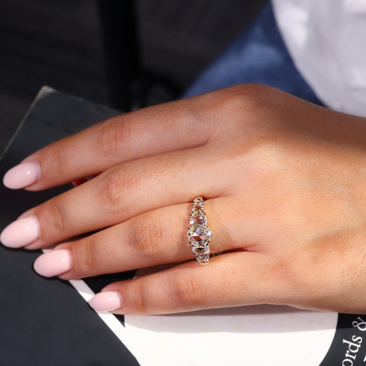 Round rose cut side stone in a 7 stone layout.