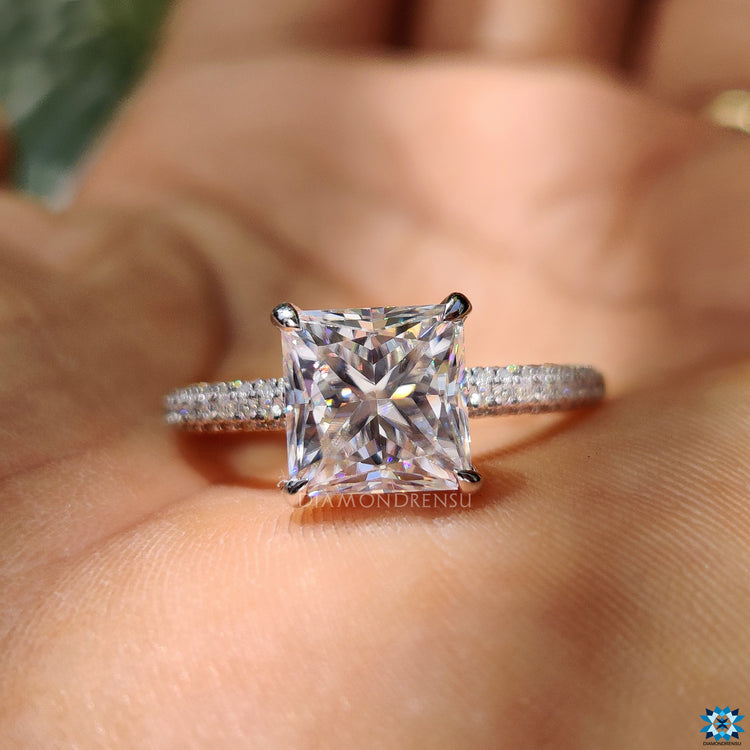 Custom engagement ring with hidden halo and princess cut centre stone.