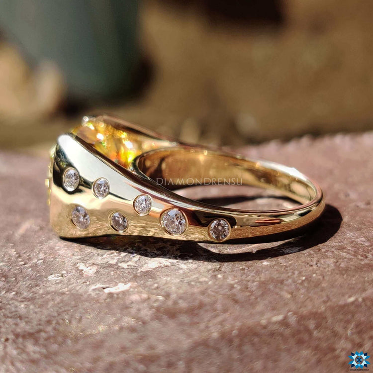 Cathedral setting ring with vibrant yellow cushion cut moissanite.
