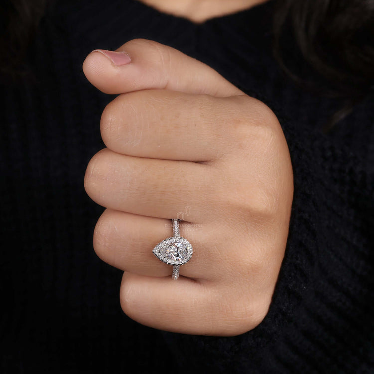 Pear cut engagement ring with a pave diamond setting for exceptional sparkle and beauty.
