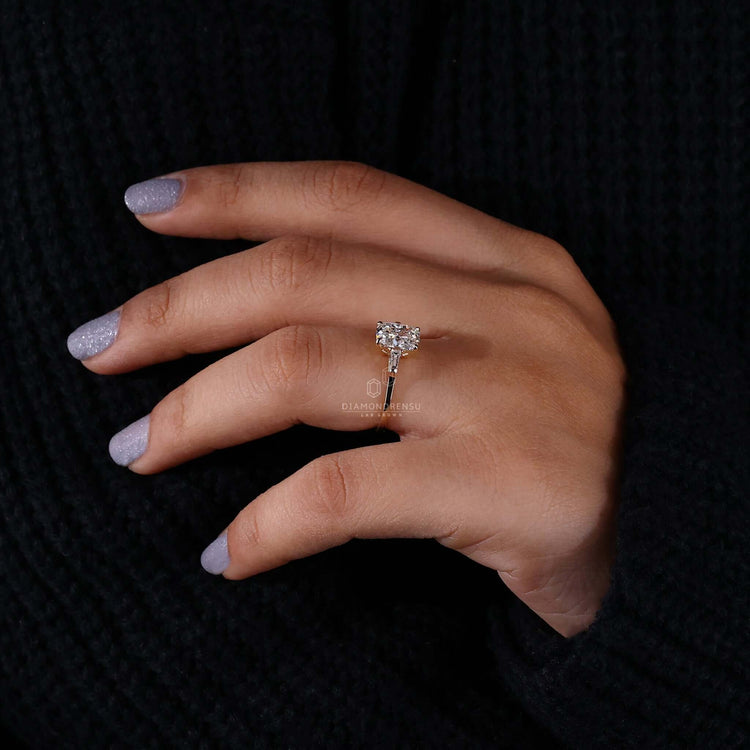 Diamond ring with tapered baguettes adding a unique touch to any outfit.