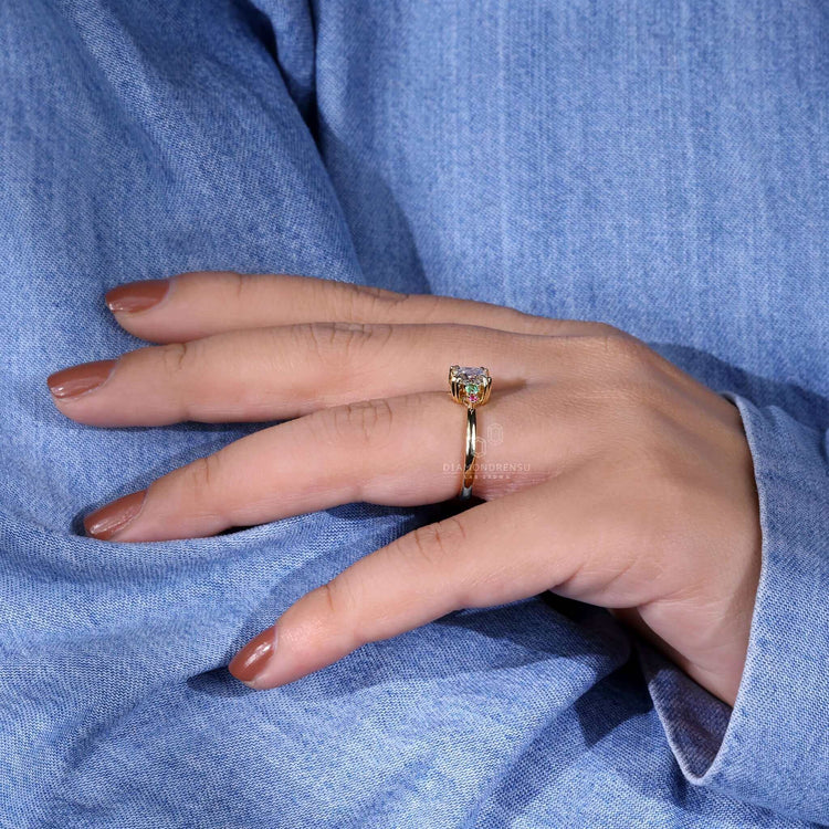 Pink sapphire ring with a handmade jewelry design, featuring a princess cut diamond for a luxurious engagement piece.