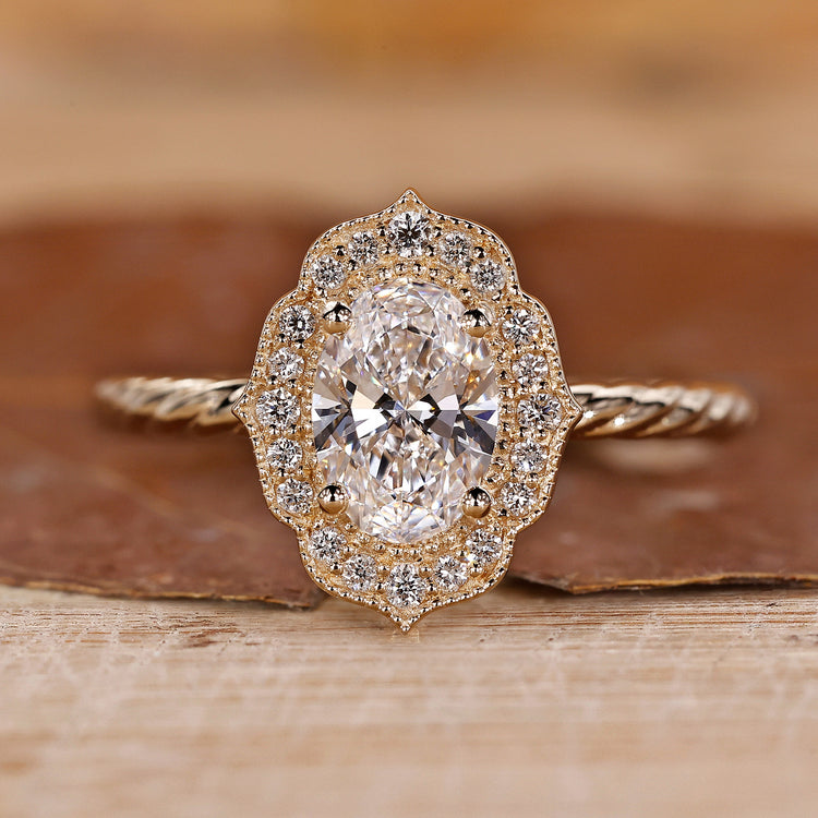 Oval Diamond Engagement Ring is made using a yellow gold ring and round diamond ring.