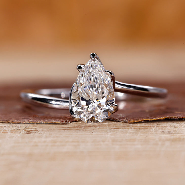 Pear shaped ring with a solitaire lab grown diamond.