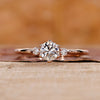 Three stone engagement ring made using rose gold ring.