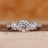 Three diamond engagement ring with tapered pave set in white gold.