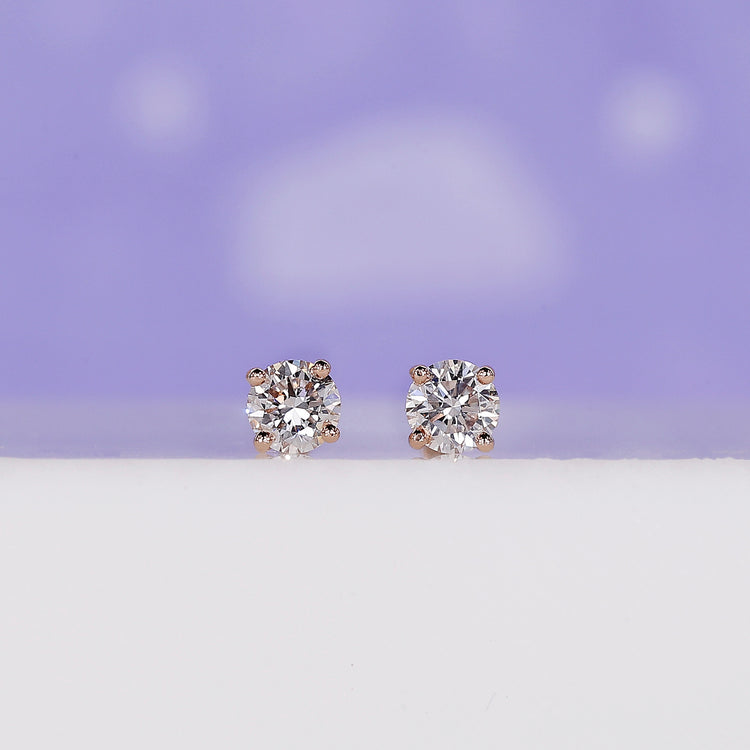 Rose gold diamond stud earrings with screw back.