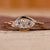 East west engagement ring featuring a marquise diamond in yellow gold.
 East west engagement ring featuring a marquise diamond in yellow gold.