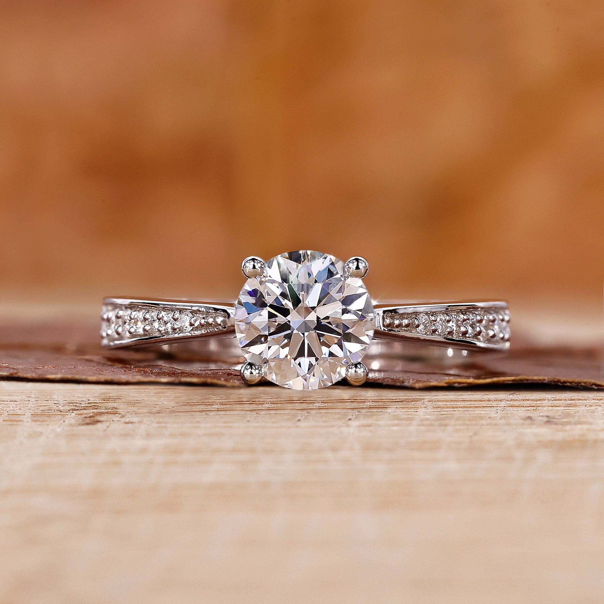 Round diamond engagement ring with Tapered Pave Setting.