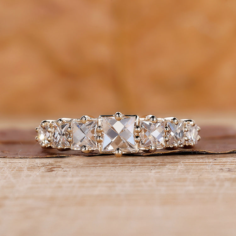 French cut diamond band crafted in yellow gold with a clean design.