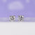 Diamond stud earrings crafted in white gold with round cut stones. Diamond stud earrings crafted in white gold with round cut stones.