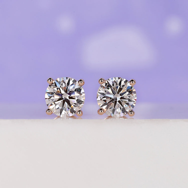 2 carat round diamond stud earrings.