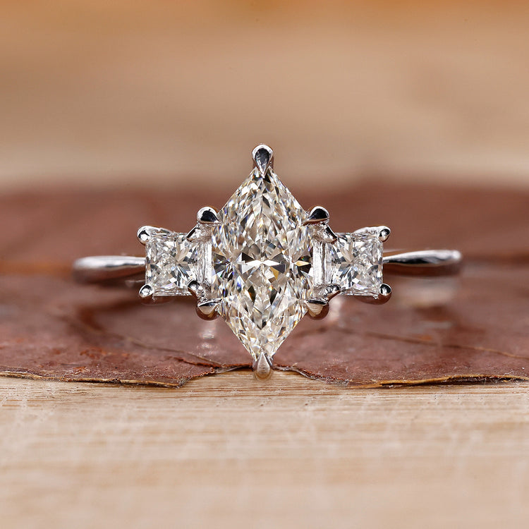 3 stone engagement ring with Dutch marquise diamond ring.