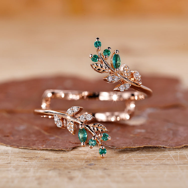 Emerald and diamond wedding band crafted in a graceful curved design.