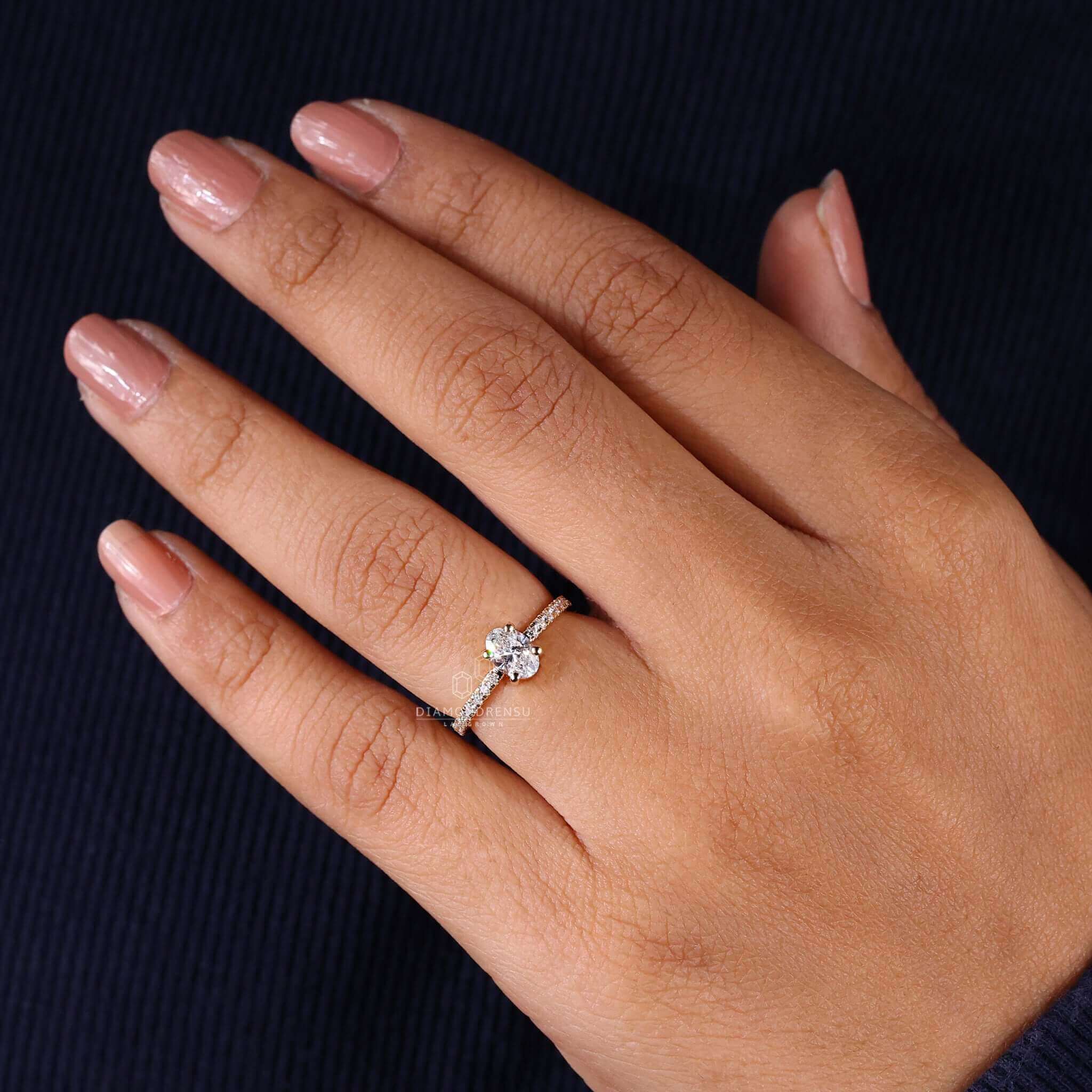 Oval engagement ring crafted in yellow gold, offering a blend of modern style and traditional beauty.