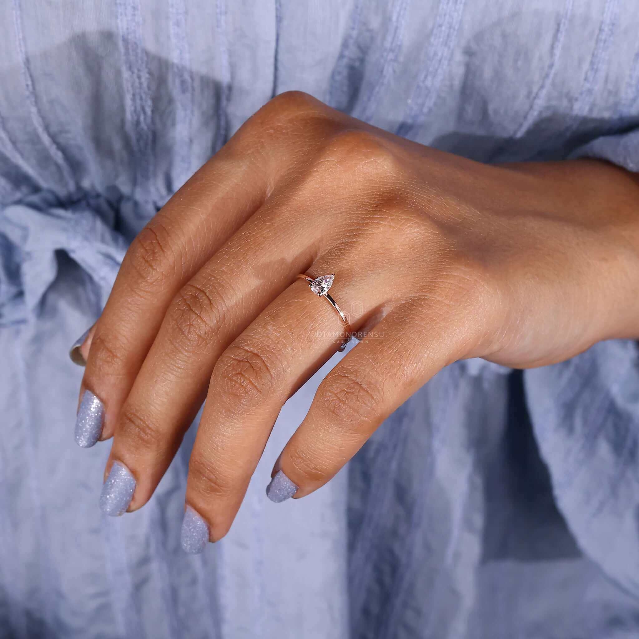 Simple solitaire pear cut ring ideal for engagement occasions.