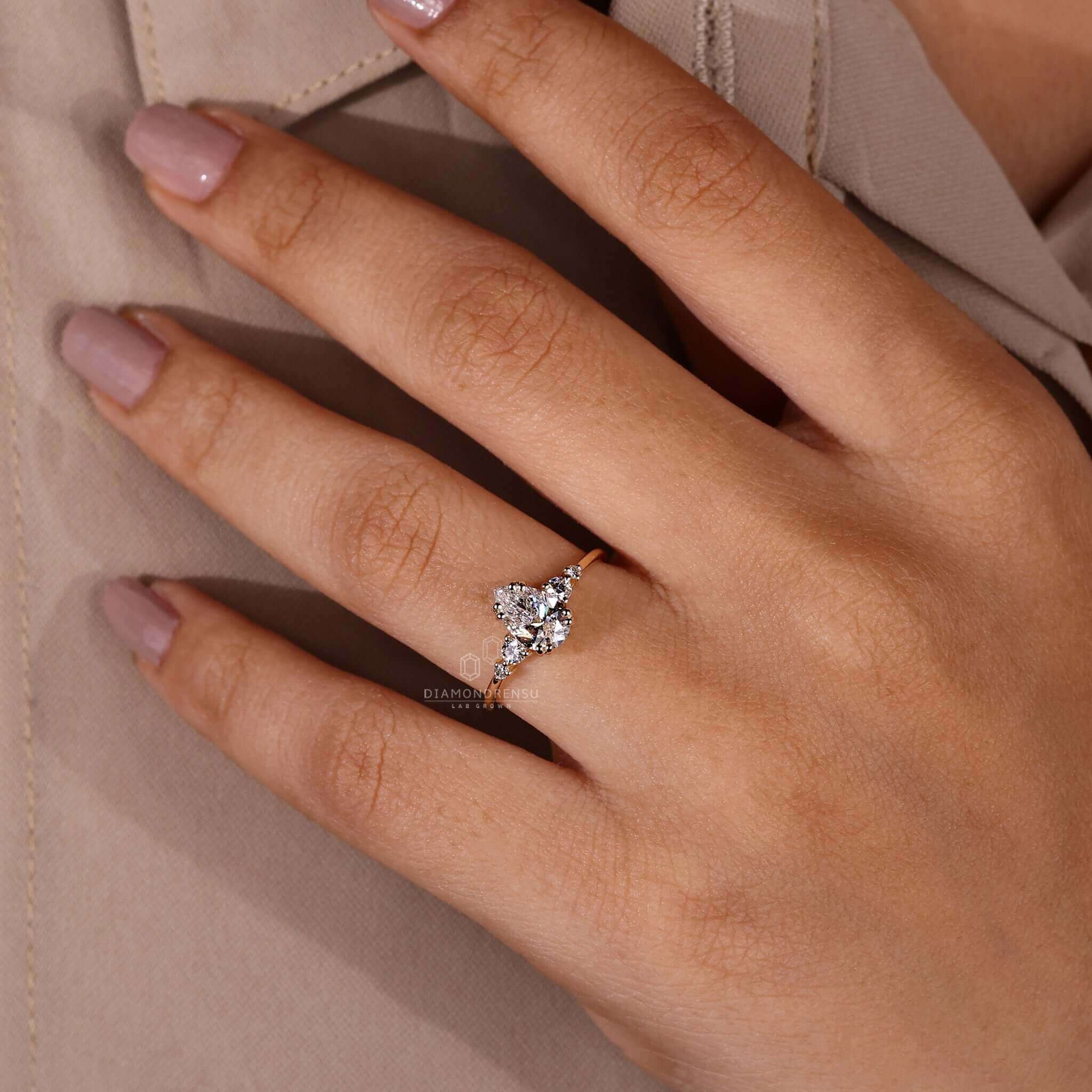 Pear shaped ring diamond with a prong ring setting, perfect as a yellow gold engagement ring.
