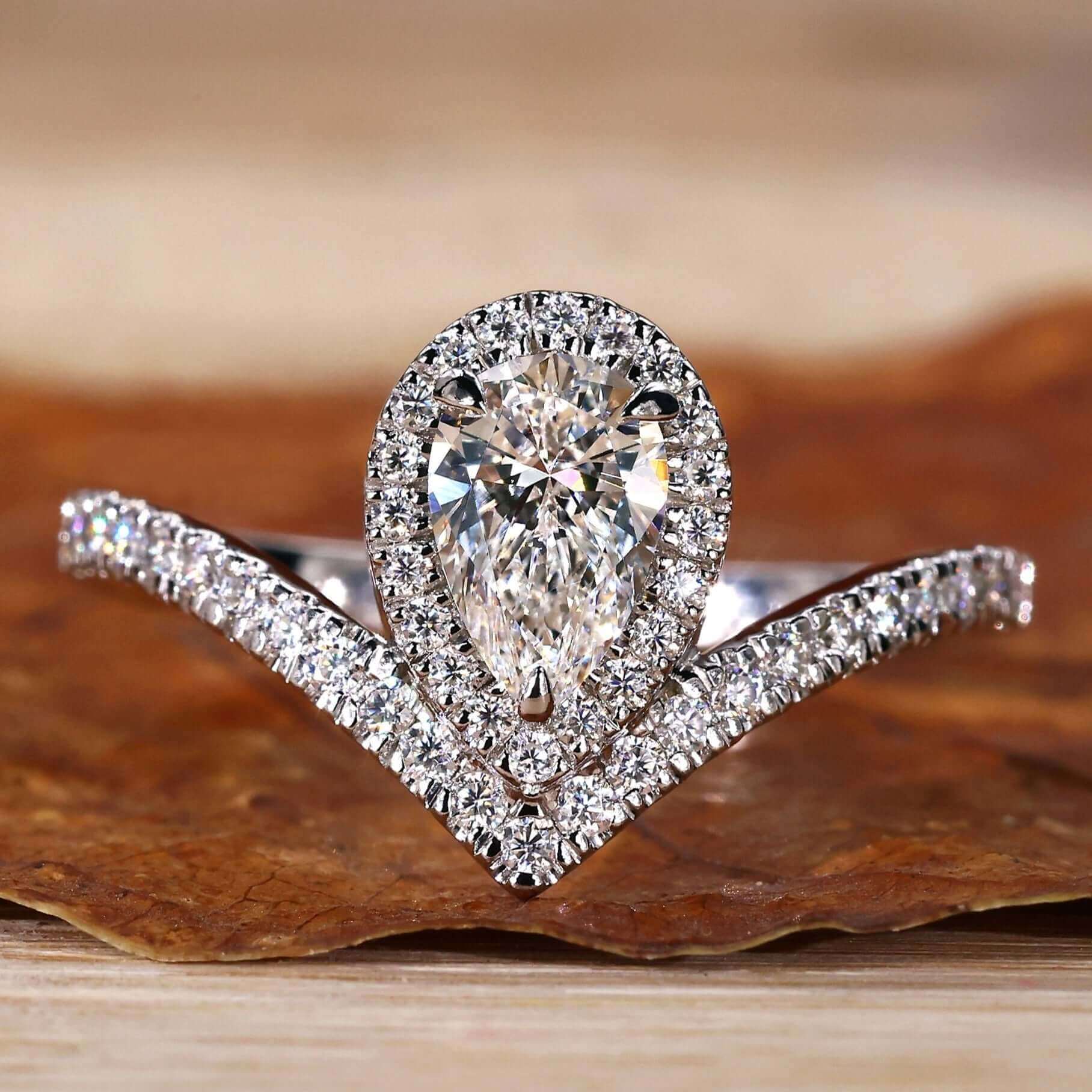 Pear Cut Engagement Ring featuring a halo ring setting for added brilliance, crafted with Lab Grown Diamond.