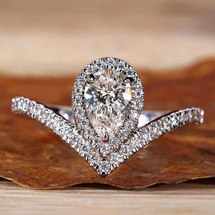 Pear Cut Engagement Ring featuring a halo ring setting for added brilliance, crafted with Lab Grown Diamond.