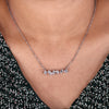 White gold pendant featuring multi shape diamonds in a prong setting.