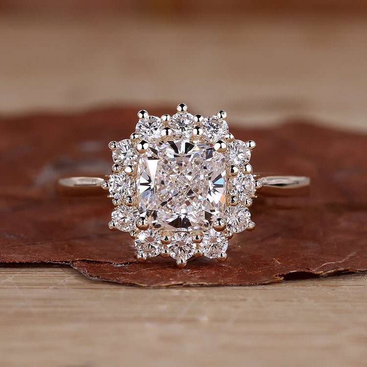 Cushion cut diamond ring in yellow gold.