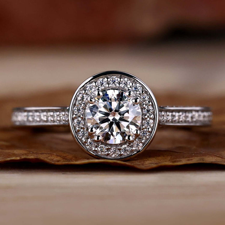 Halo diamond engagement ring with a stunning round diamond in a 4 prong diamond setting.