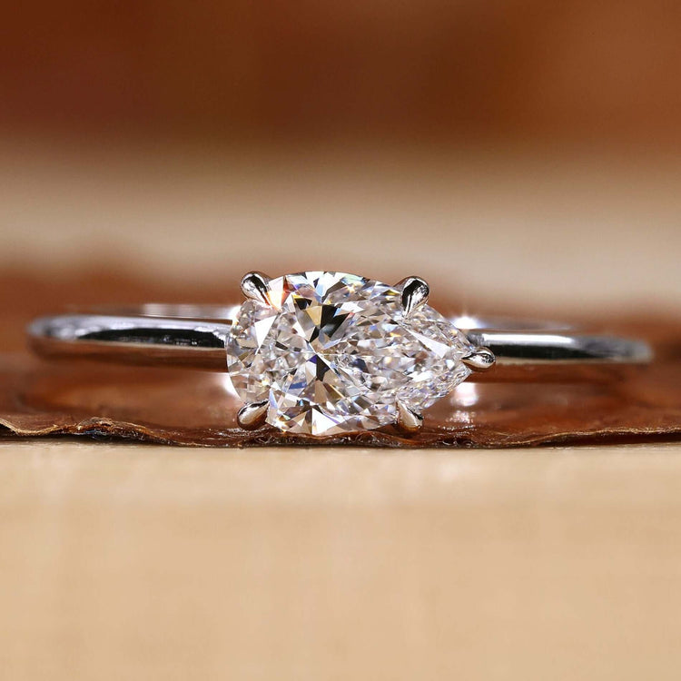Pear diamond engagement ring with a stunning east to west design