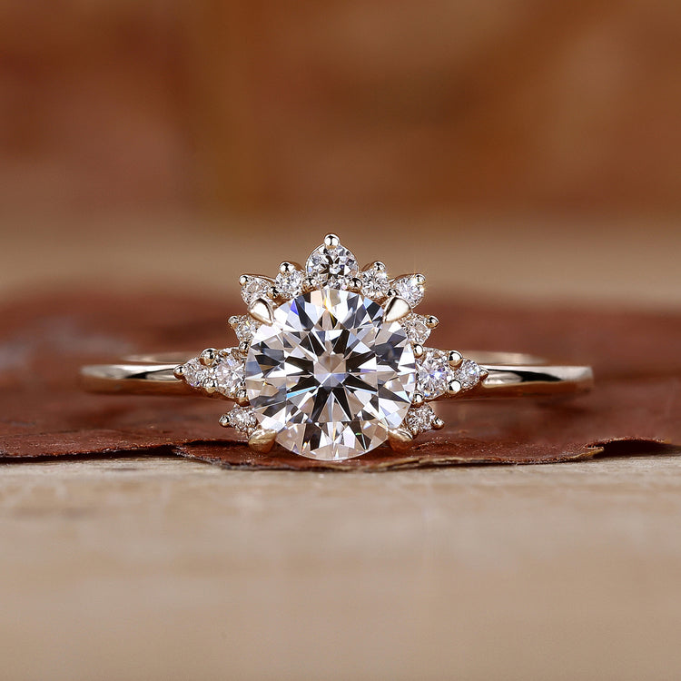 Round halo engagement ring in yellow gold.