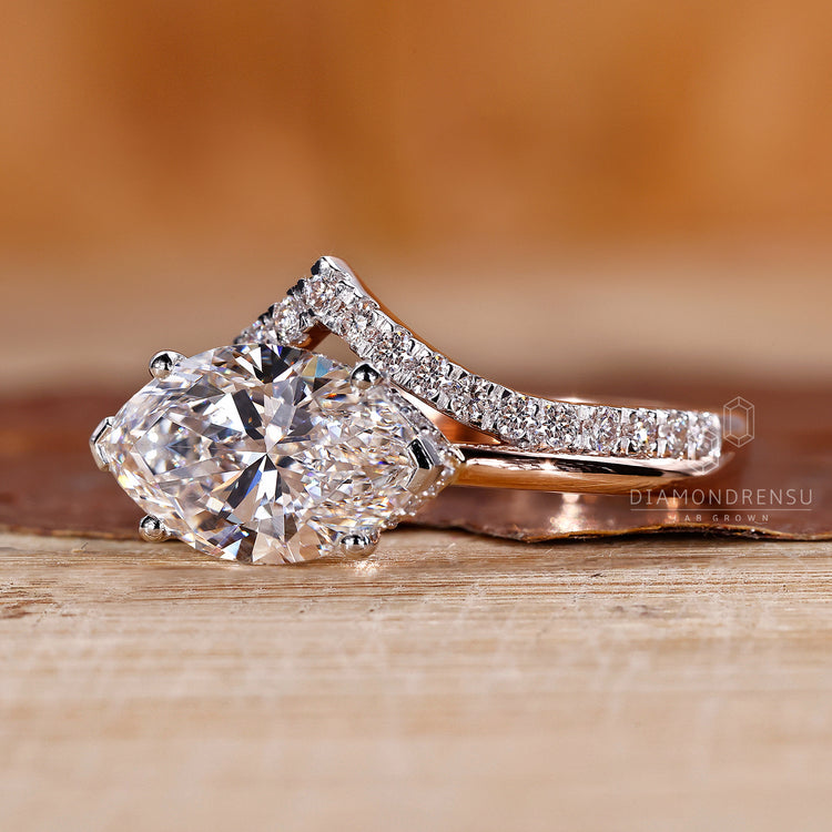 Handmade ring with V shaped prong and marquise diamond details.