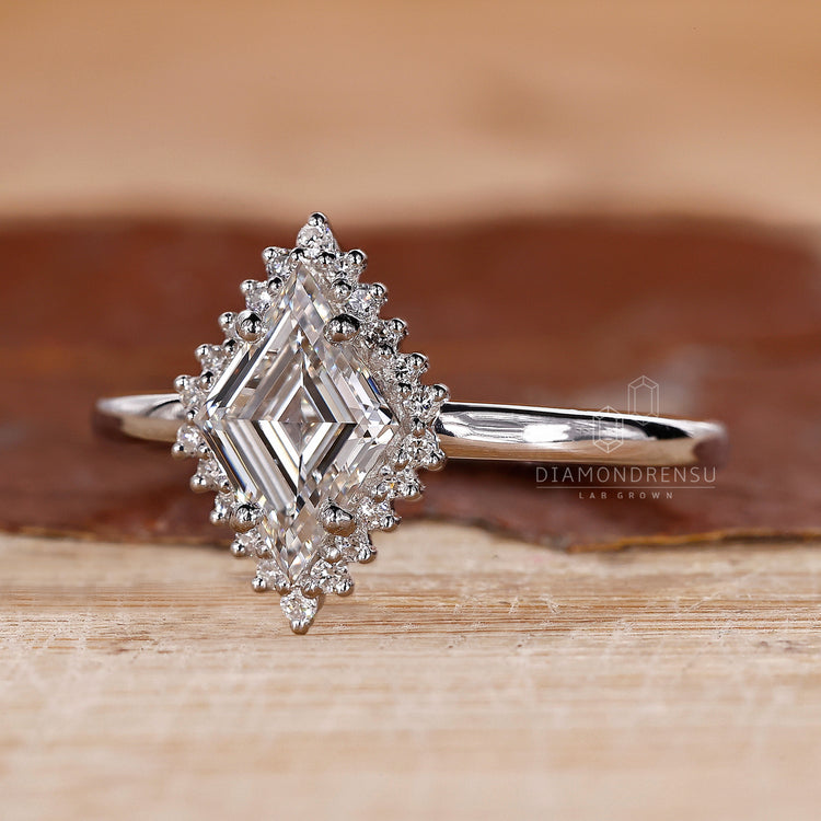 Proposal engagement ring with prong set ring and halo diamond band.