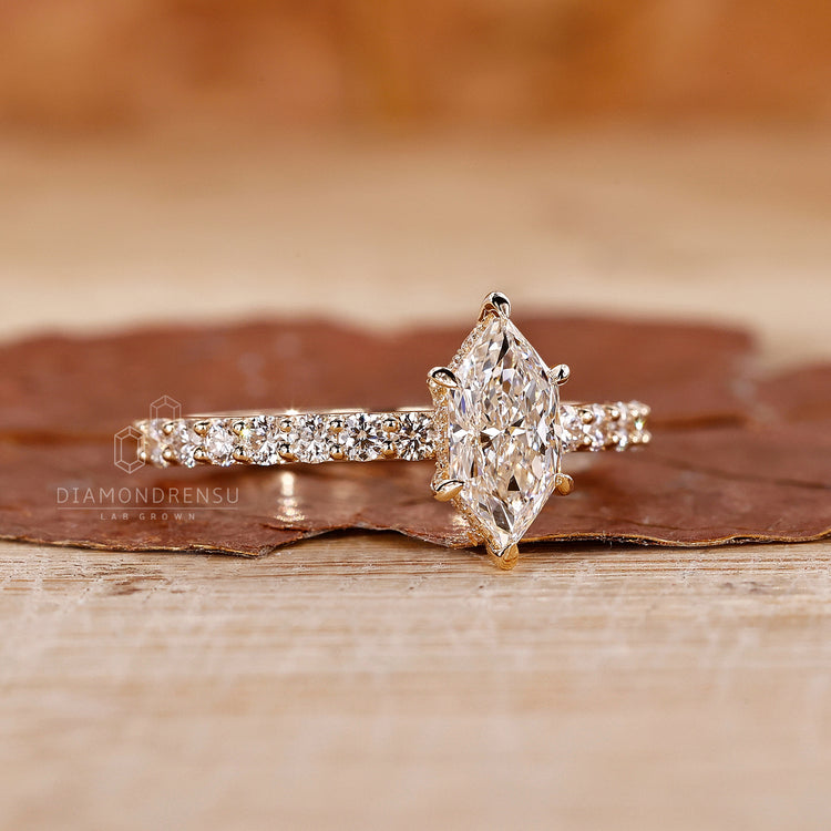 Hidden halo engagement ring includes 6 claw prong ring detail.