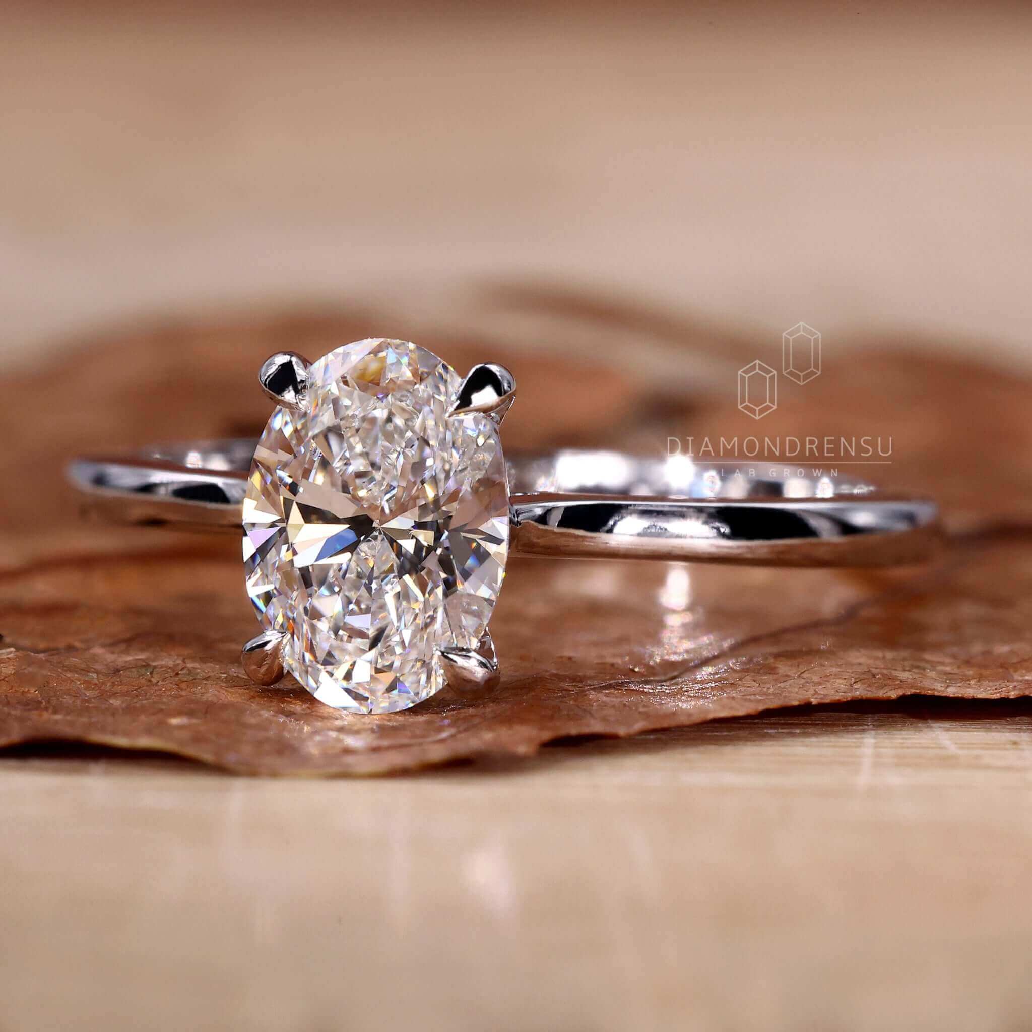 Classic solitaire ring with a radiant lab grown oval diamond.