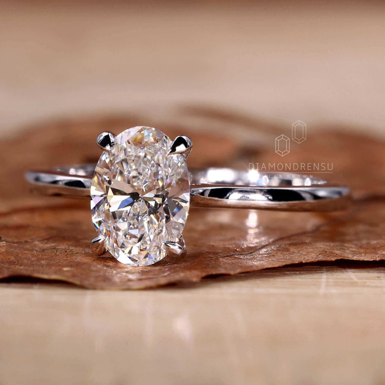 Classic solitaire ring with a radiant lab grown oval diamond.