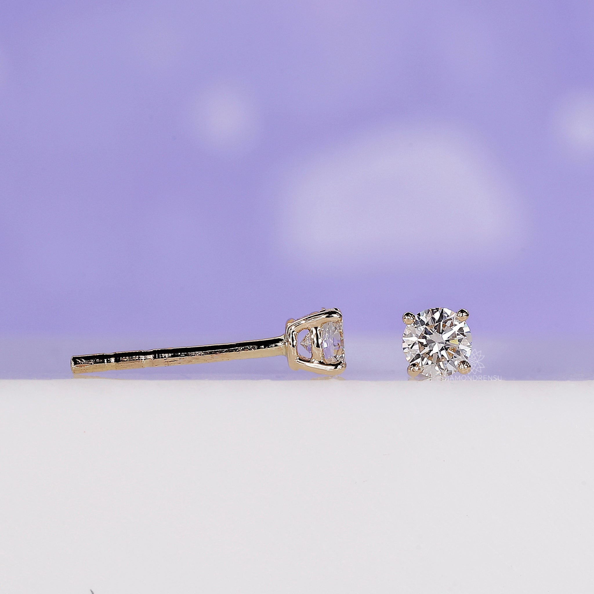 Push back stud earrings with round diamonds.