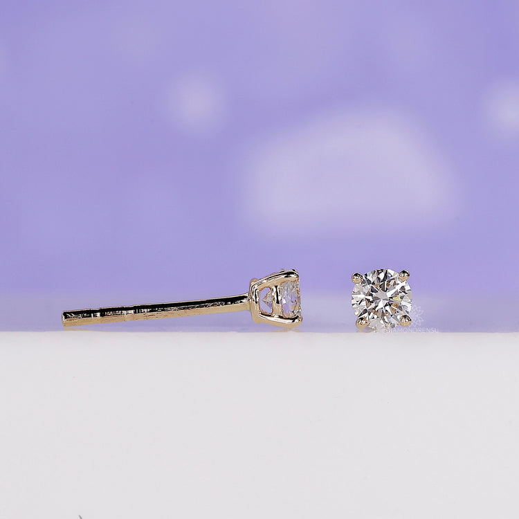 Push back stud earrings with round diamonds.