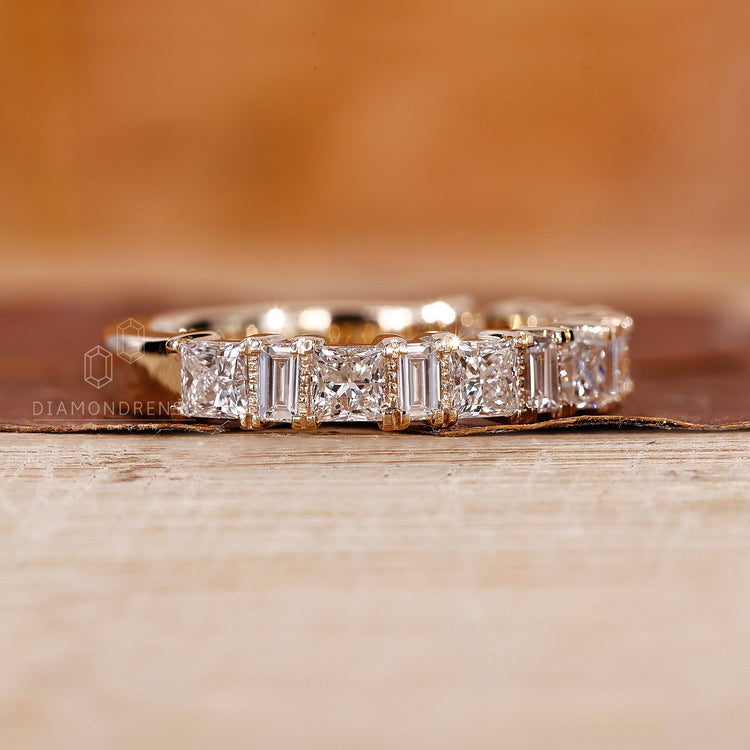 Buy wedding band in yellow gold with a unique diamond layout.