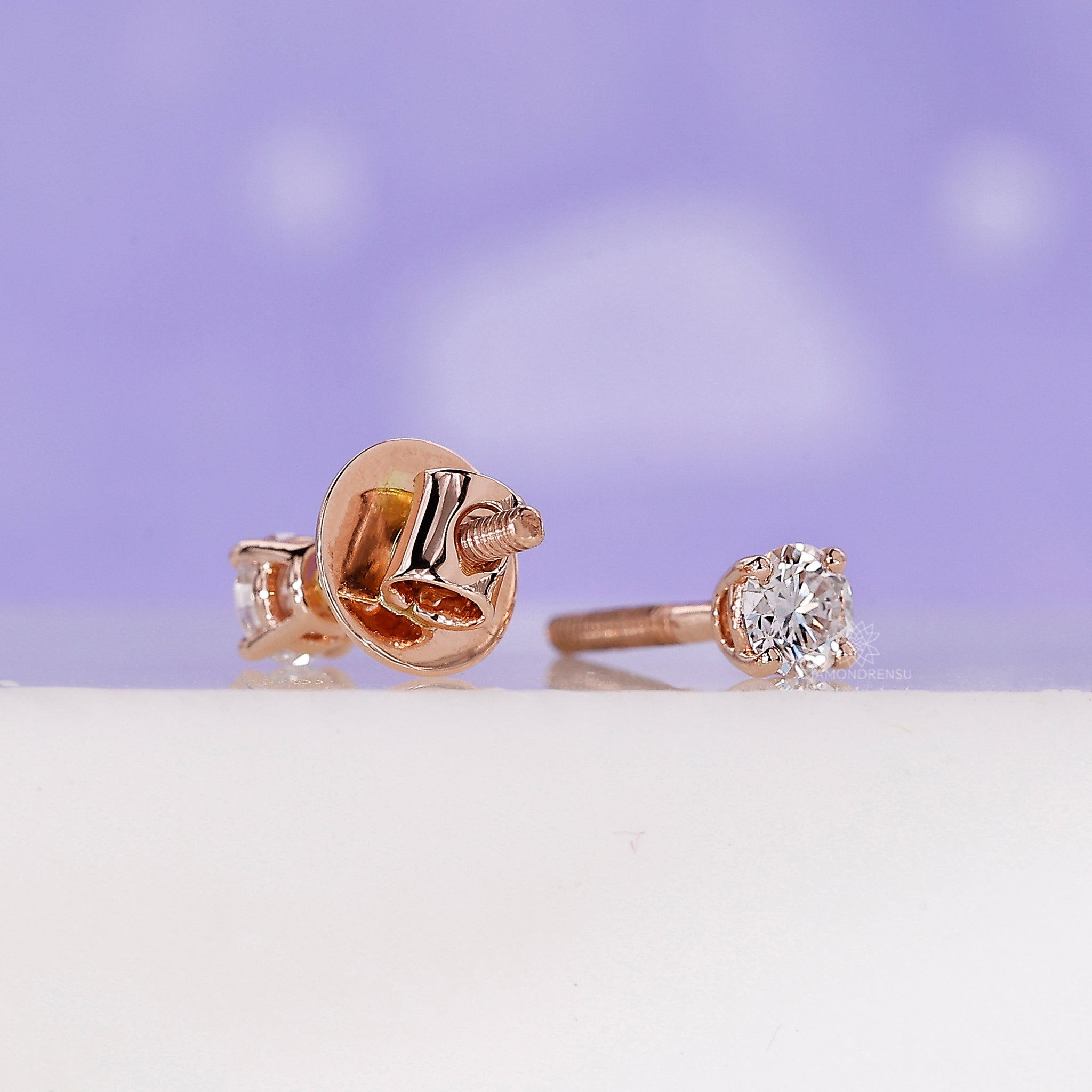 Classic round diamond rose gold studs.