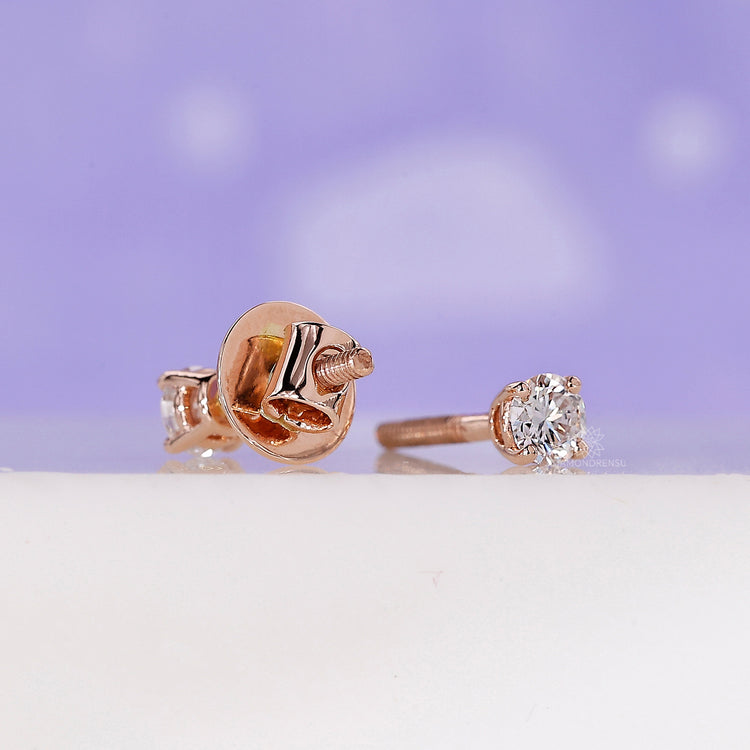 Classic round diamond rose gold studs.