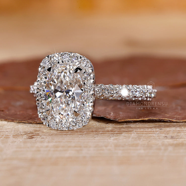 Proposal engagement ring with 4 claw prong set and prong set ring style.