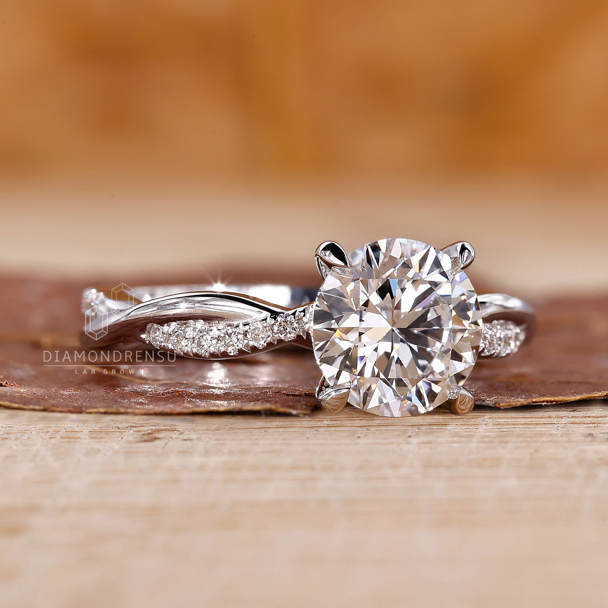 Buy engagement ring online with twisted band and 4 prong claw setting.