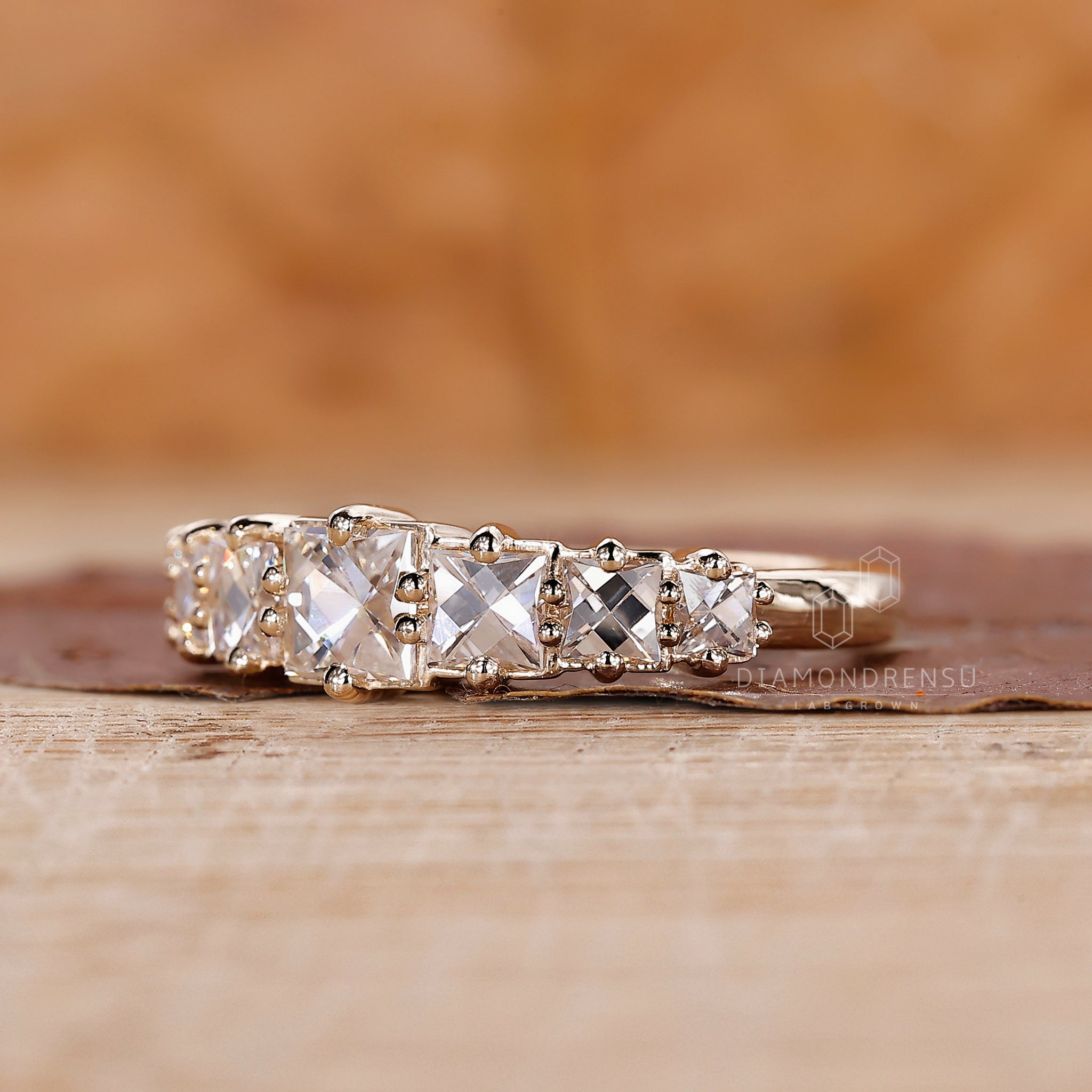 Prong set wedding band with French cut diamonds for a modern look.