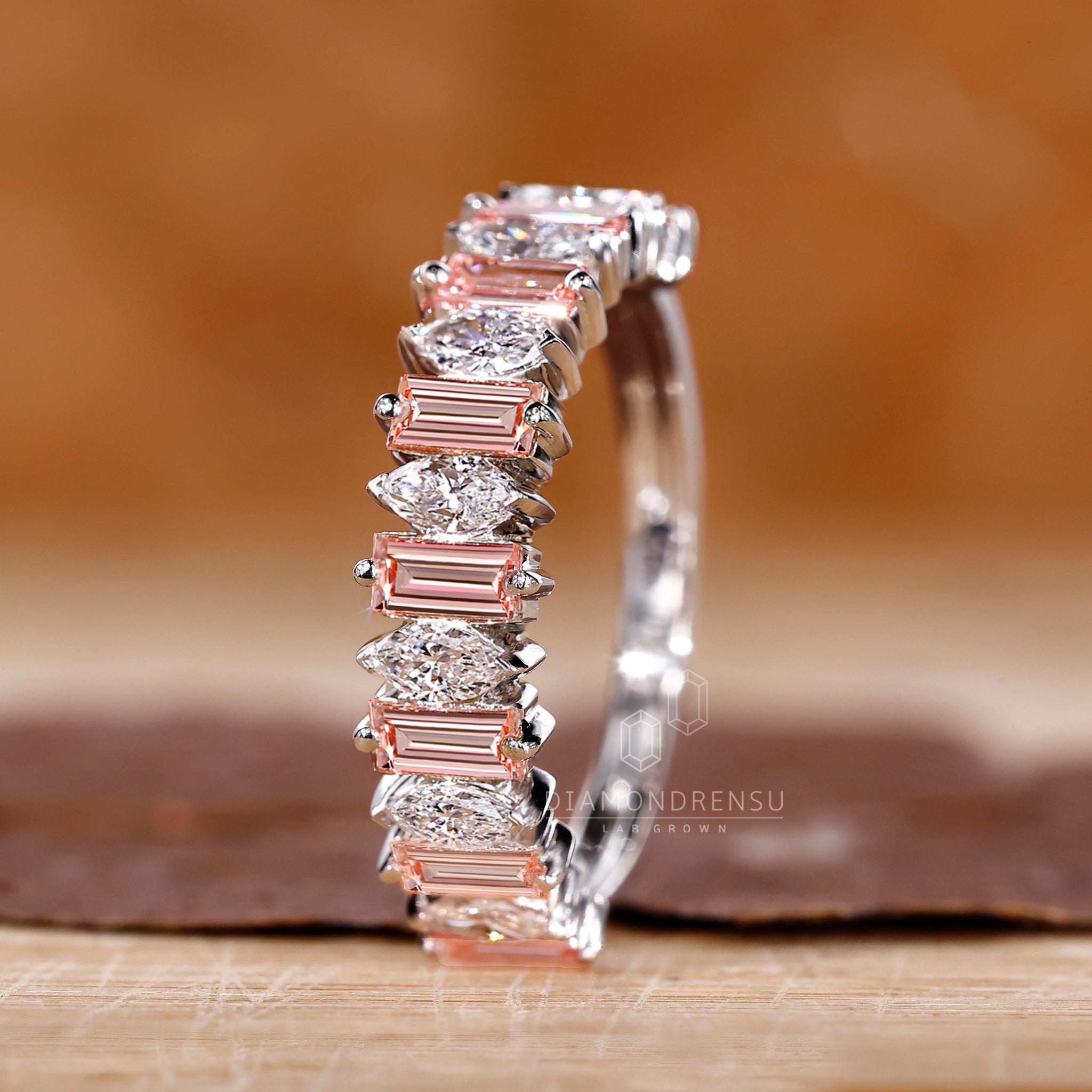 Simple wedding band crafted with lab grown baguette and marquise diamonds.