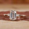 Three Stone Emerald Cut Ring featuring stunning diamonds and elegance.