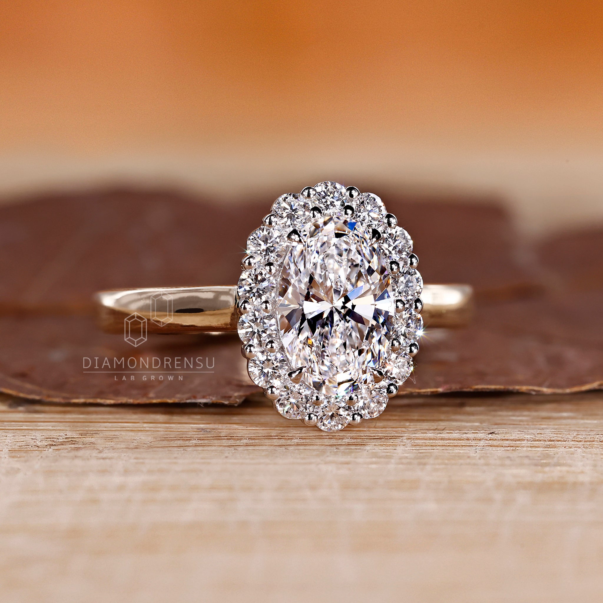 4 claw prong ring with oval and round cut diamonds.